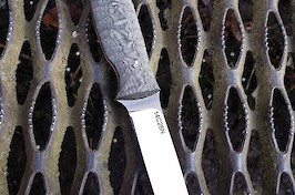 Slim and light drop-point hunter/utility knife in 14C28N and canvas micarta